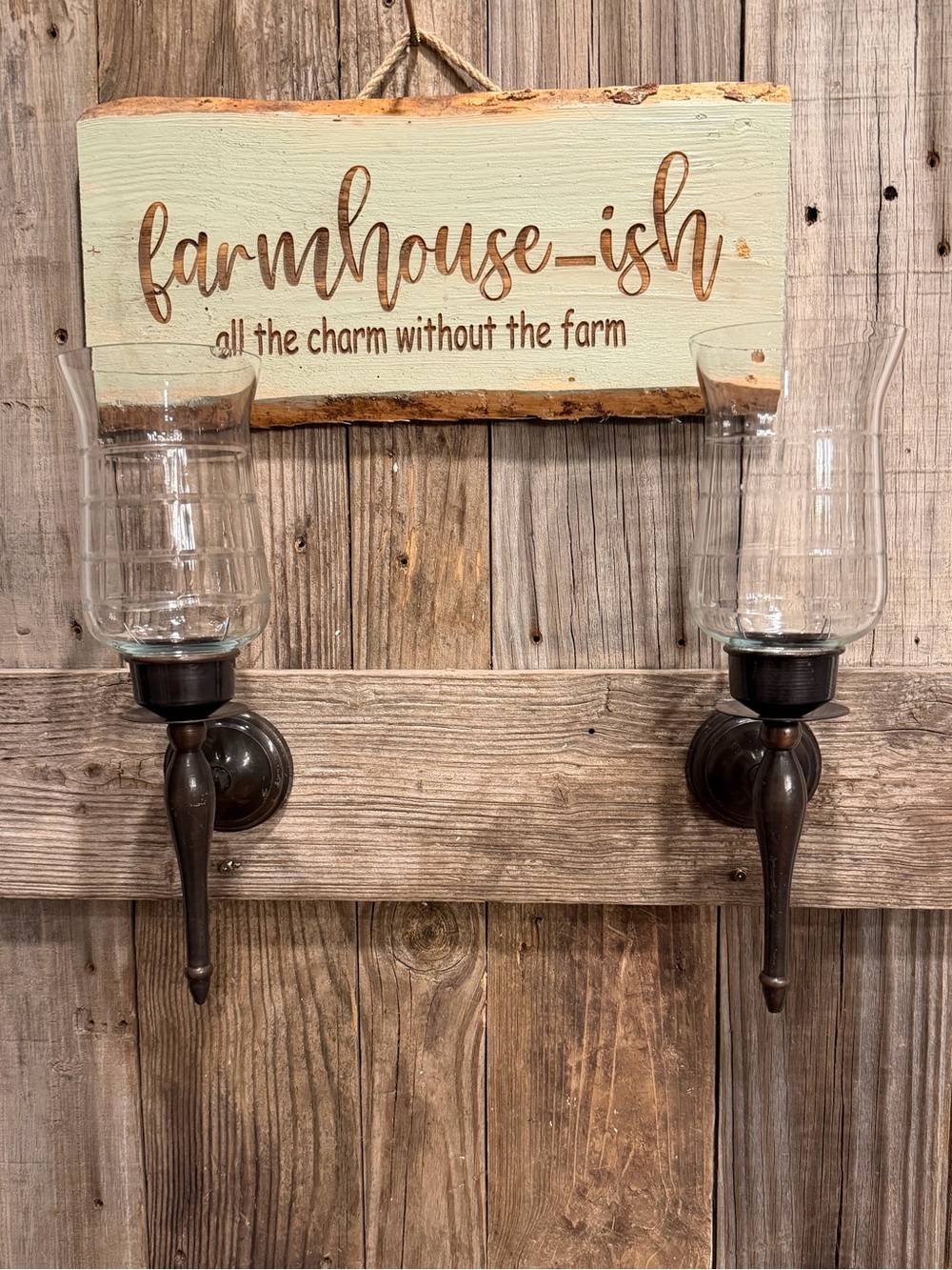 Pair of farmhouse dark bronze-toned metal candle sconces with clear glass